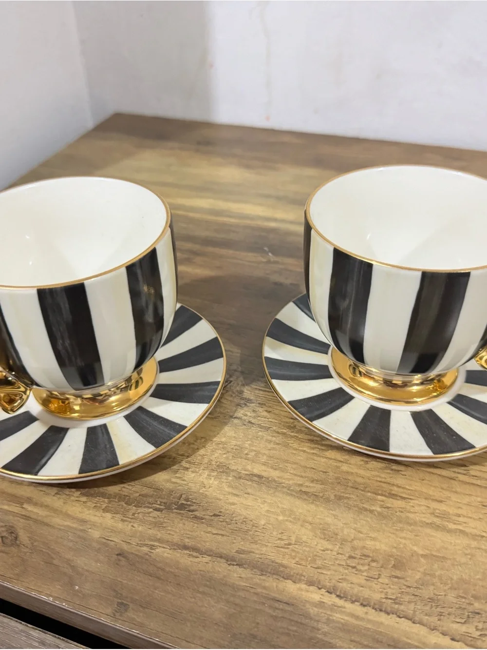 MacKenzie-Childs Black and White Striped Gold-Trim Teacup and Saucer Set pair